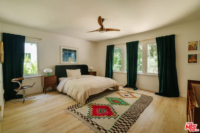 a bathroom with a granite countertop bathtub toilet and sink