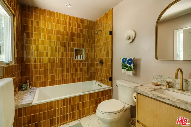 a bedroom with a bed a table and chair