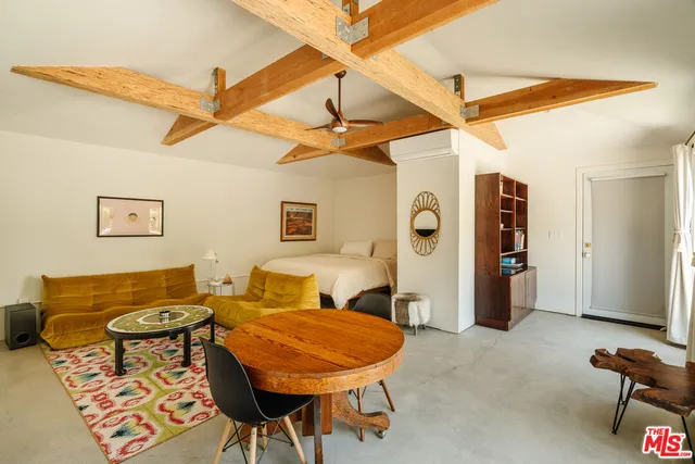 a bathroom with a granite countertop sink a mirror and vanity