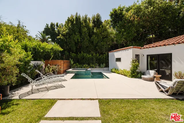 a view of a swimming pool with chairs