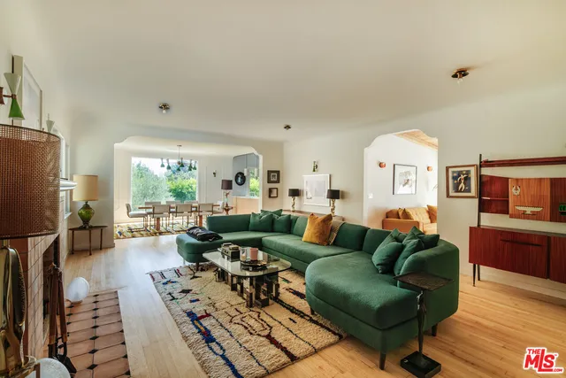 a bedroom with a bed and a fireplace