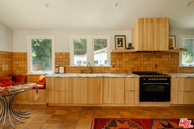 a large bathroom with a sink a mirror and a bathtub