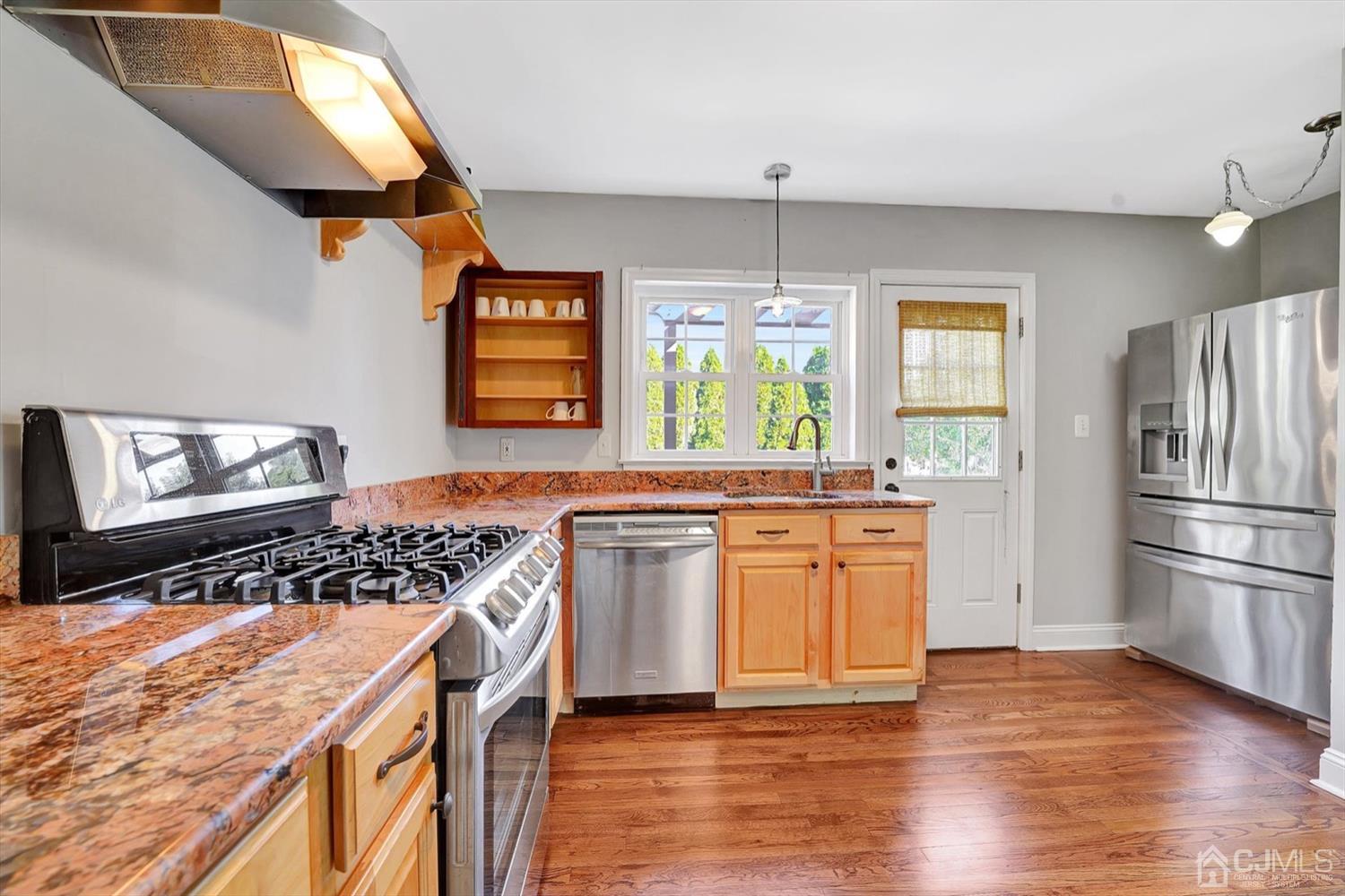 14 Middlesex Road Matawan, NJ 07747 - Photo 12 of 27 a kitchen with a stove a sink and a refrigerator