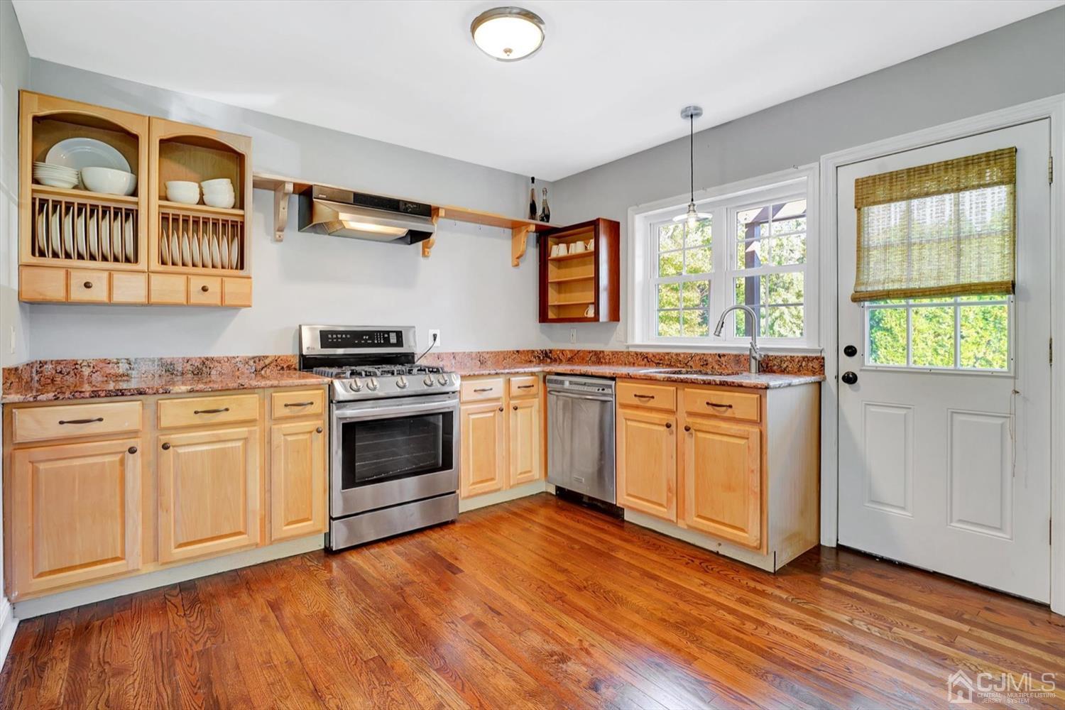 14 Middlesex Road Matawan, NJ 07747 - Photo 13 of 27 a kitchen with stainless steel appliances granite countertop a stove and a sink