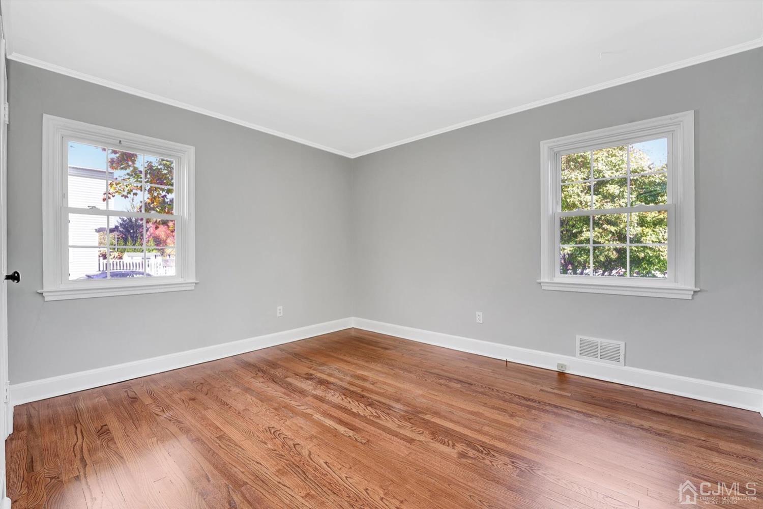 14 Middlesex Road Matawan, NJ 07747 - Photo 15 of 27 a view of empty room with window and wooden floor