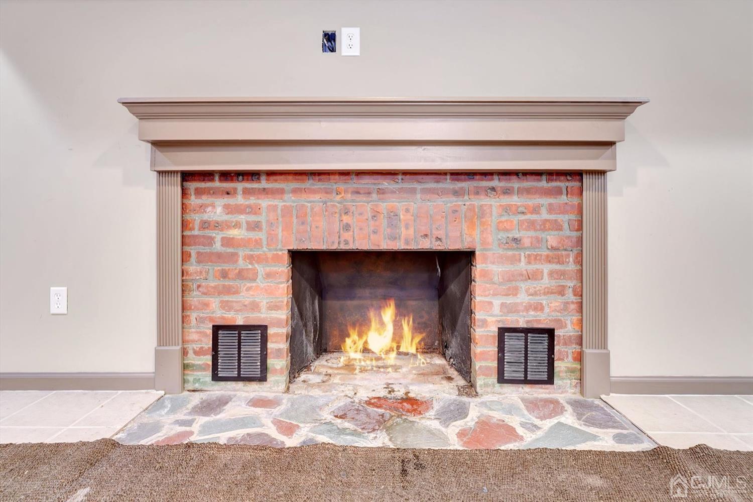 14 Middlesex Road Matawan, NJ 07747 - Photo 18 of 27 a fireplace with a rug