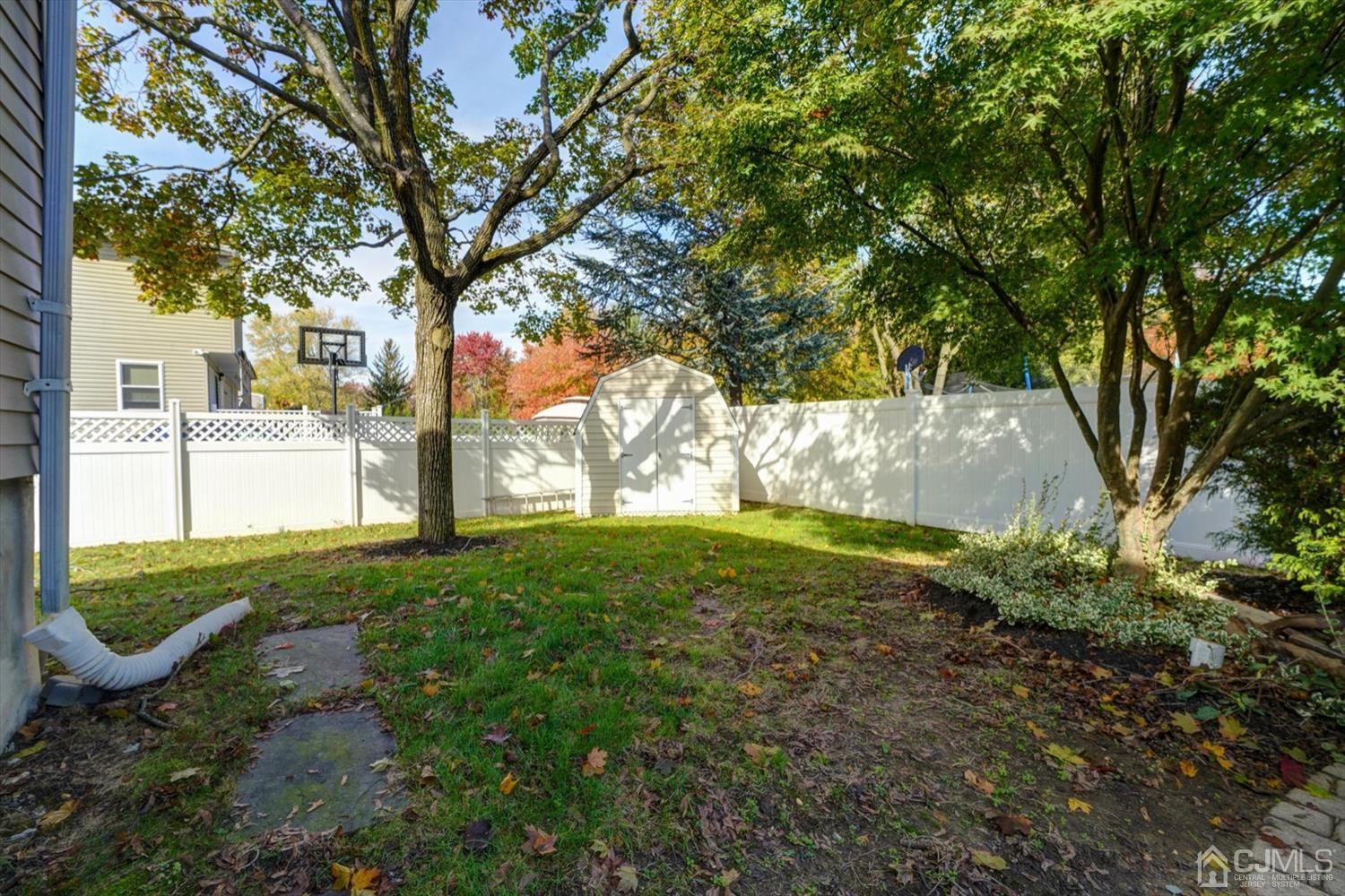 14 Middlesex Road Matawan, NJ 07747 - Photo 24 of 27 a view of a yard with plants and trees