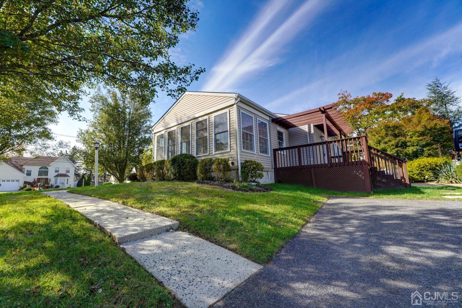 14 Middlesex Road Matawan, NJ 07747 - Photo 25 of 27 a view of a big house with a big yard and large trees