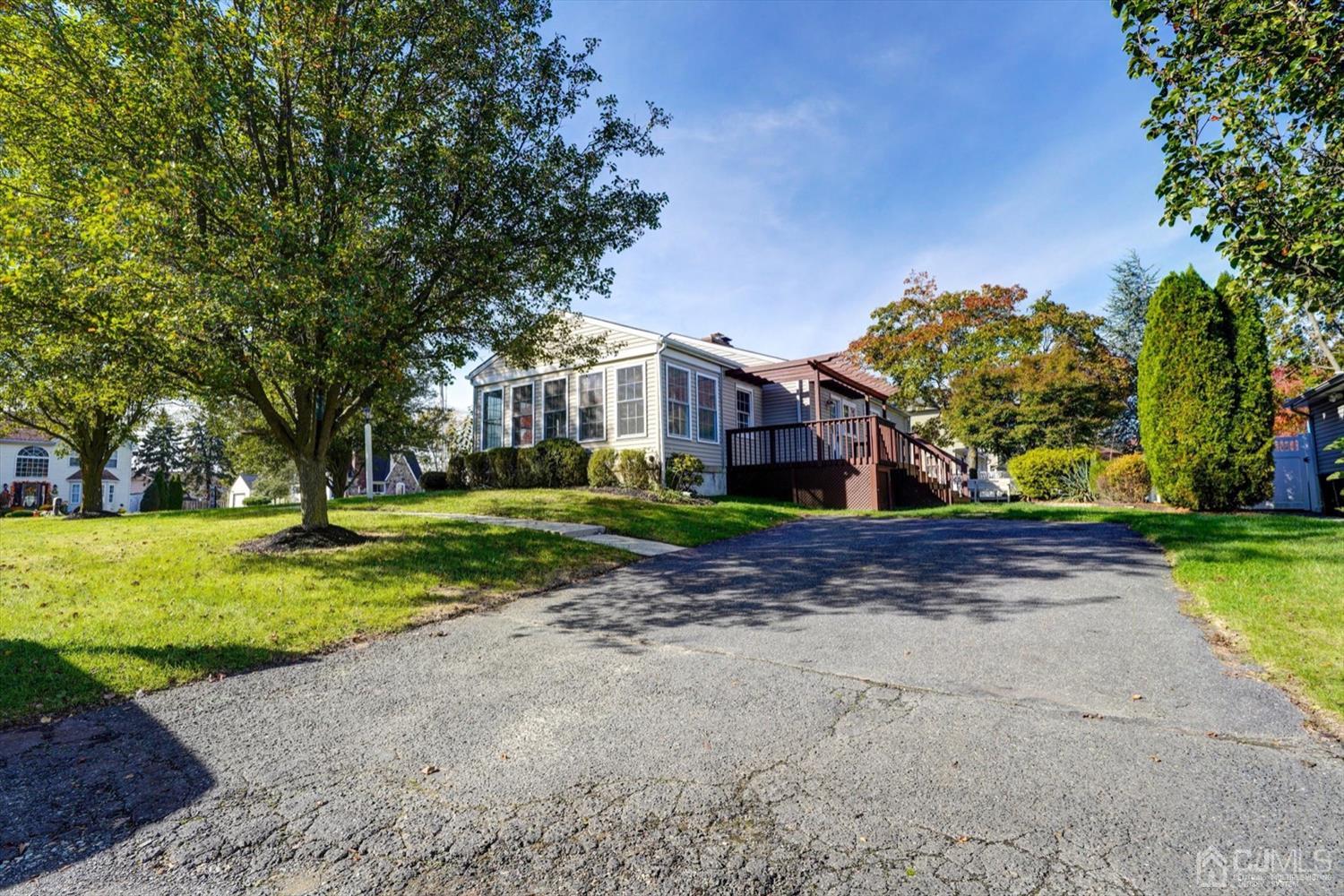 14 Middlesex Road Matawan, NJ 07747 - Photo 26 of 27 a view of a house with a yard and large trees