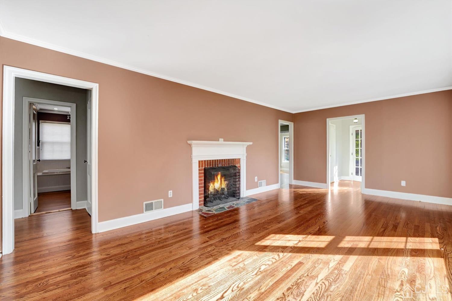 14 Middlesex Road Matawan, NJ 07747 - Photo 4 of 27 a view of a livingroom with wooden floor and a fireplace