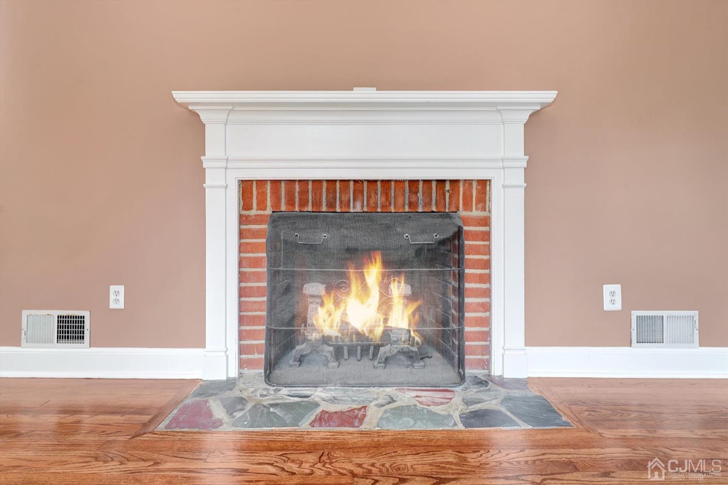 14 Middlesex Road Matawan, NJ 07747 - Photo 7 of 27 a view of fireplace with wooden floor