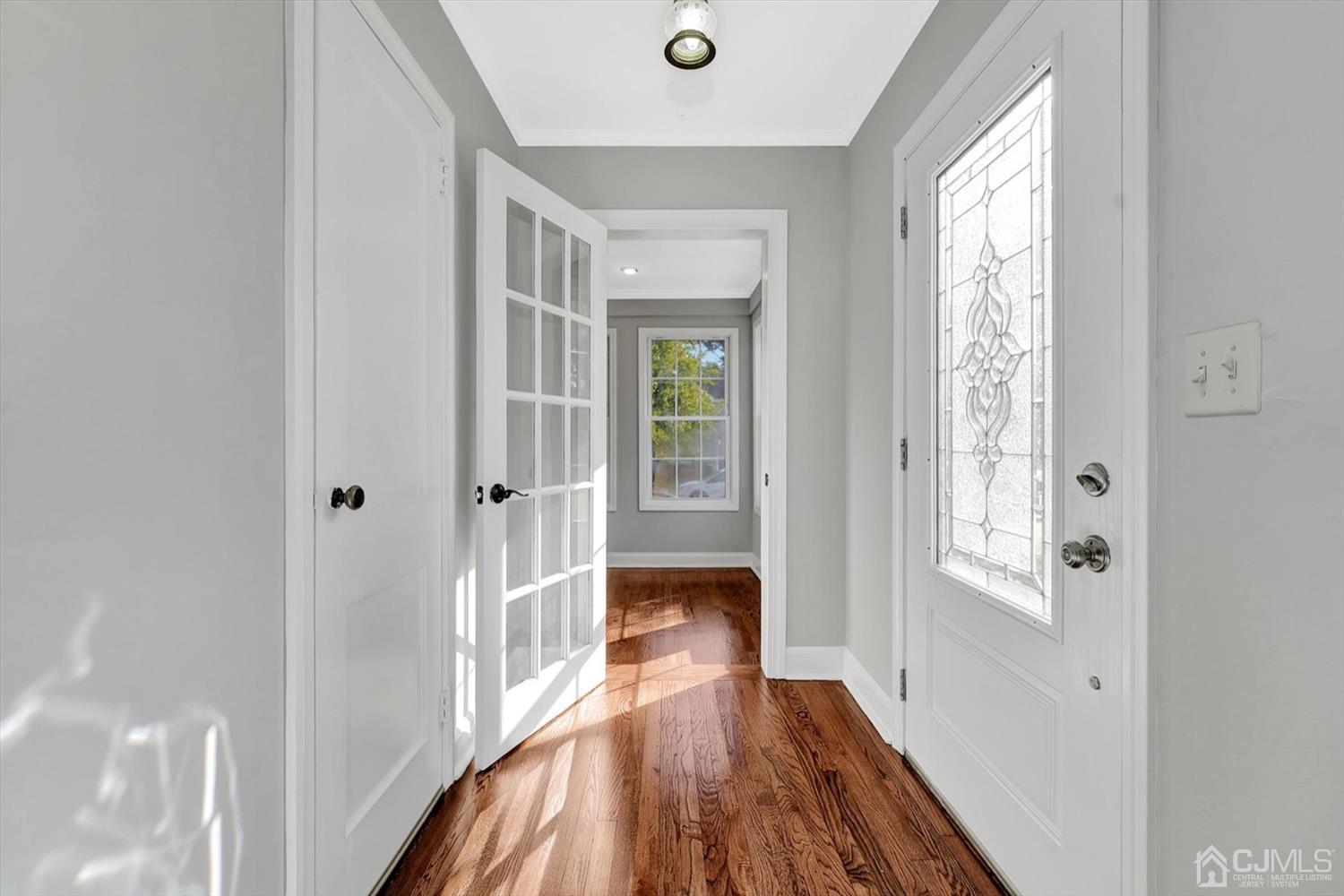 14 Middlesex Road Matawan, NJ 07747 - Photo 8 of 27 a view of a hallway with wooden floor and staircase