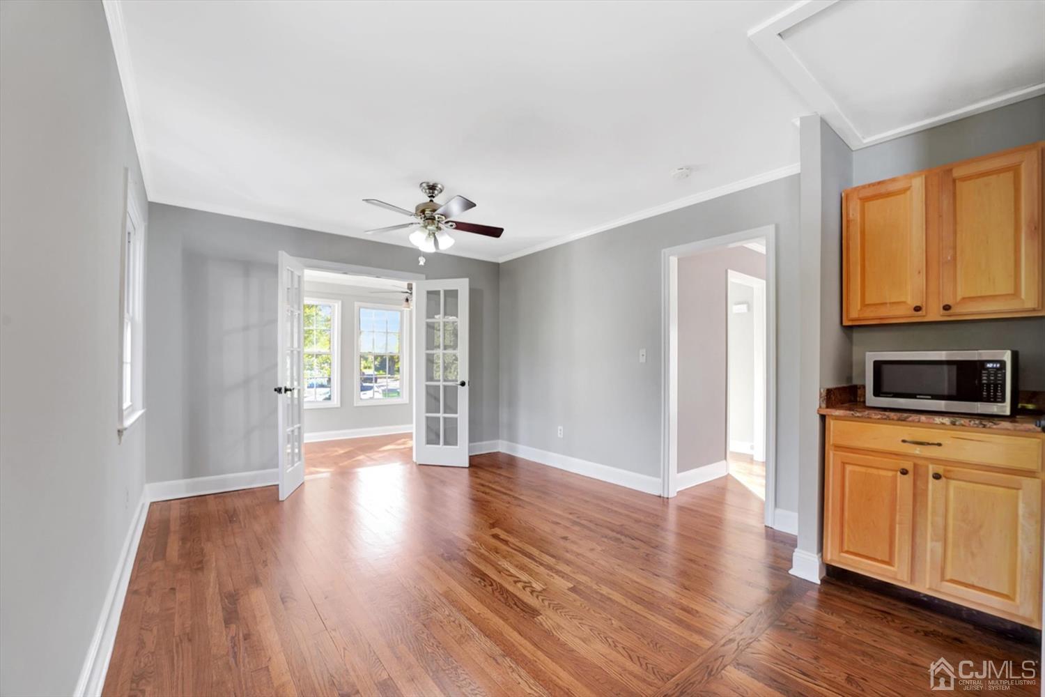 14 Middlesex Road Matawan, NJ 07747 - Photo 10 of 27 a view of a kitchen with a stove wooden floor and a window