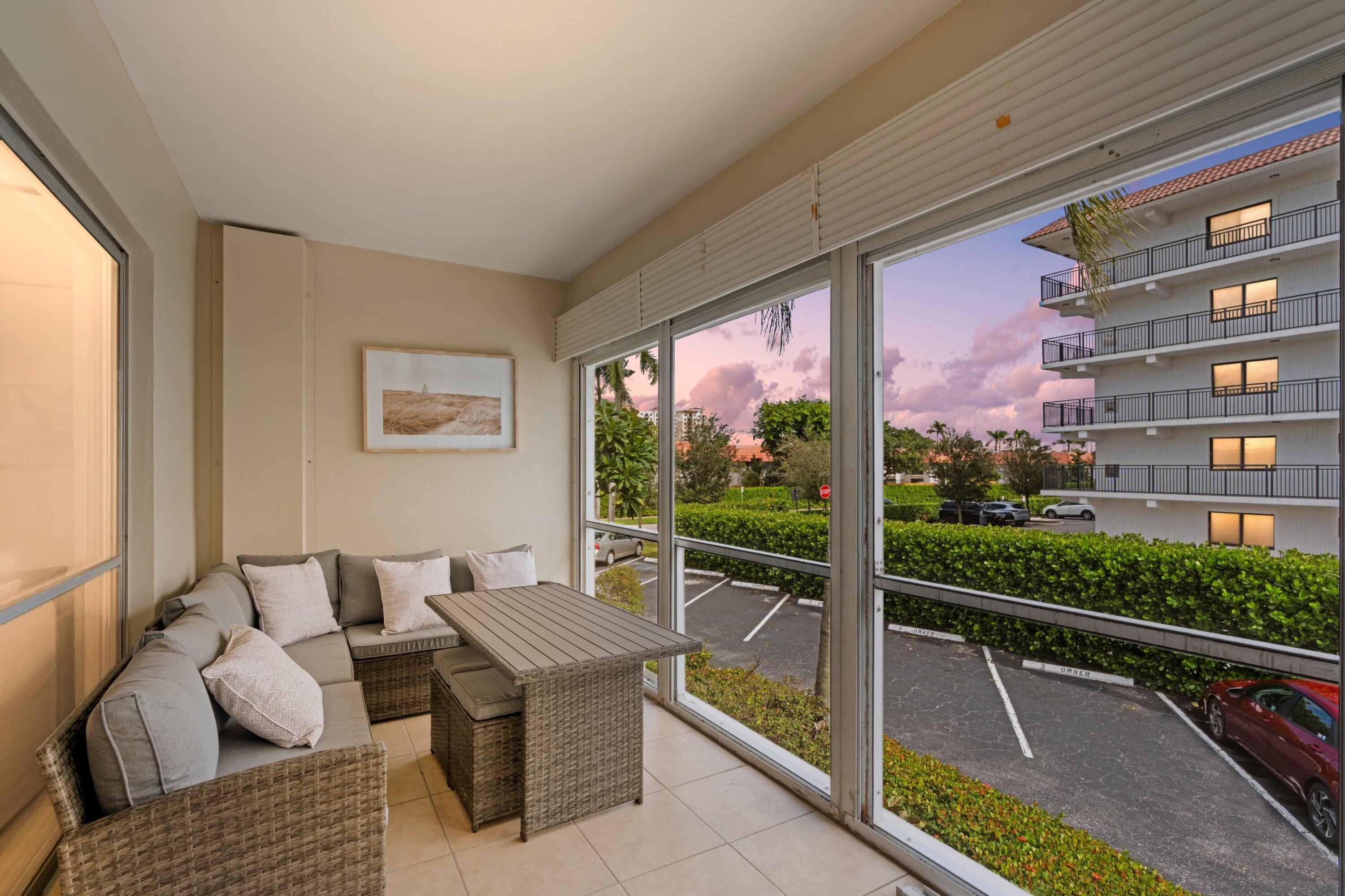 40 Southeast 13th Street, Unit B1 Boca Raton, FL 33432 - Photo 2 of 34 a view of balcony with couch