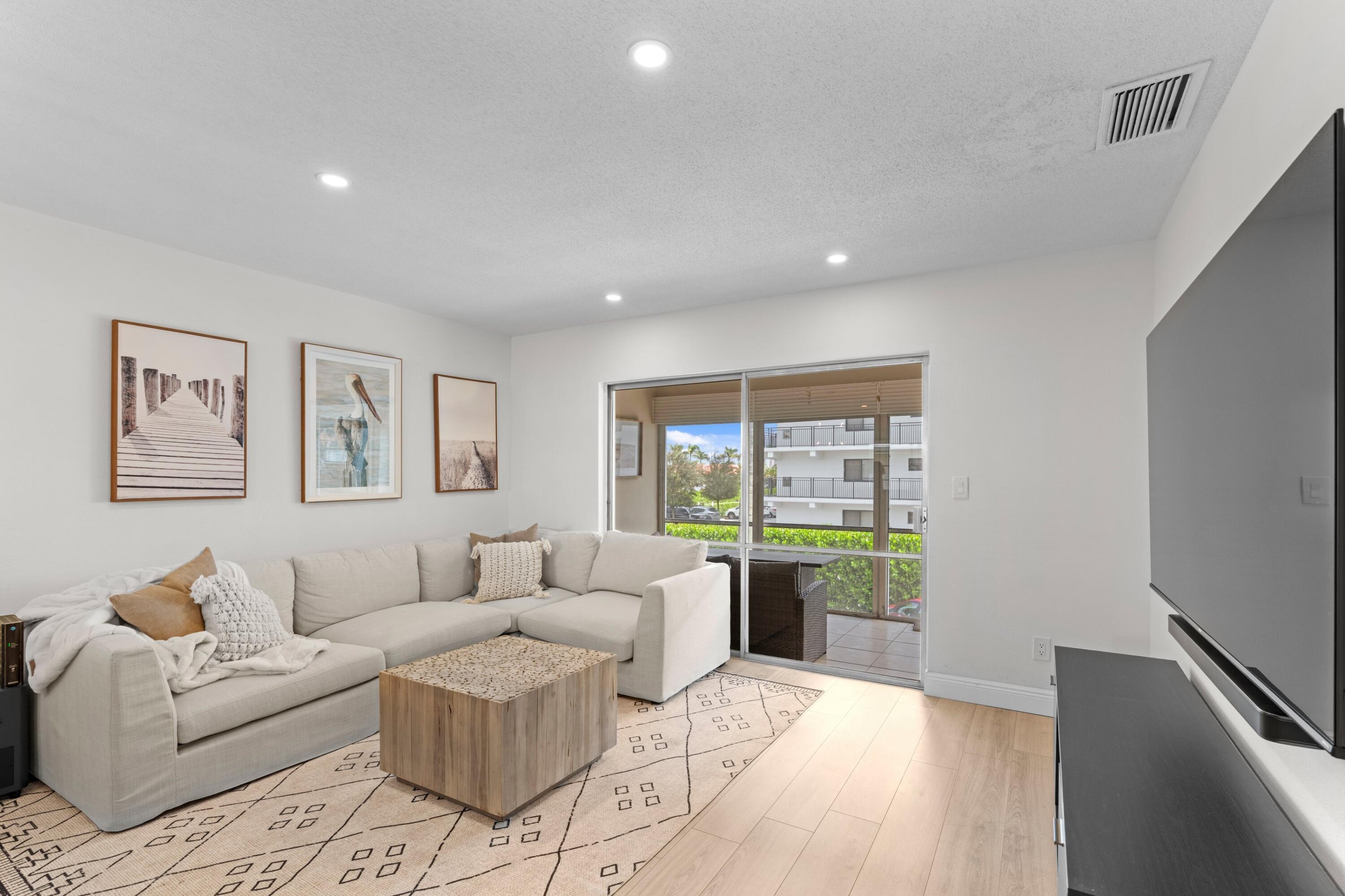 40 Southeast 13th Street, Unit B1 Boca Raton, FL 33432 - Photo 4 of 34 a living room with furniture and a window
