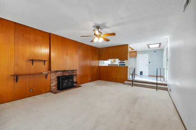 an empty room with a fireplace