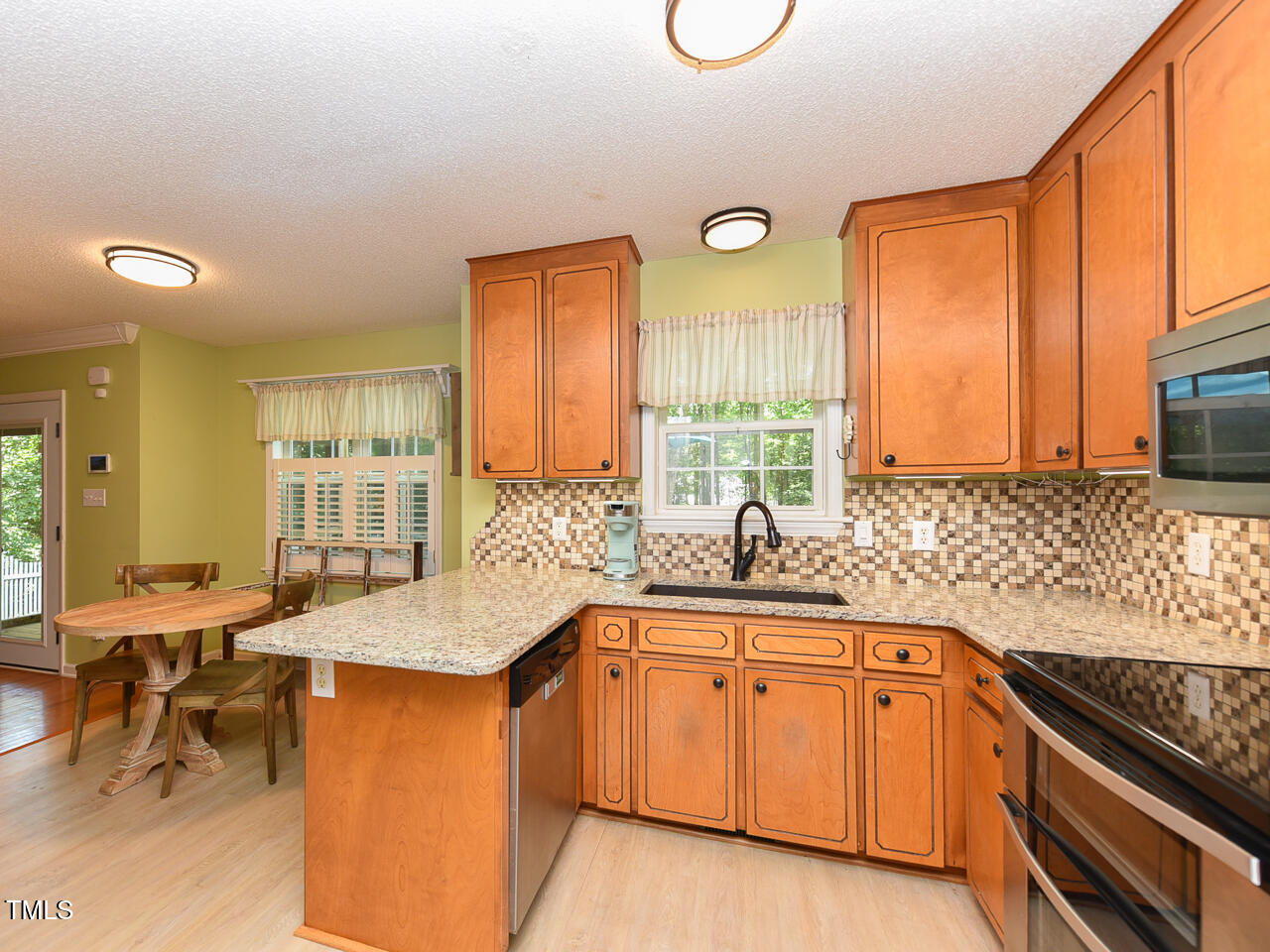 125 Walker Run Selma, NC 27576 - Photo 12 of 47 a kitchen with a sink stove and cabinets