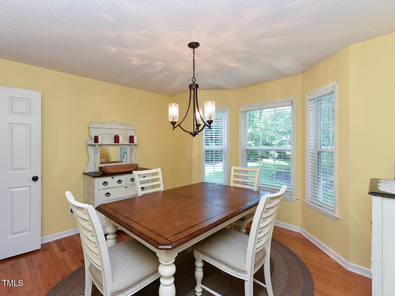 125 Walker Run Selma, NC 27576 - Photo 14 of 47 a view of a dining room with furniture window and wooden floor