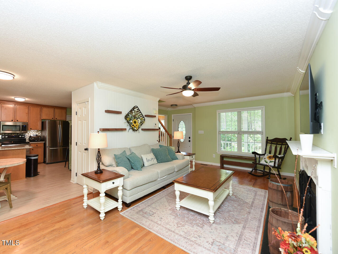125 Walker Run Selma, NC 27576 - Photo 16 of 47 a living room with furniture and a chandelier