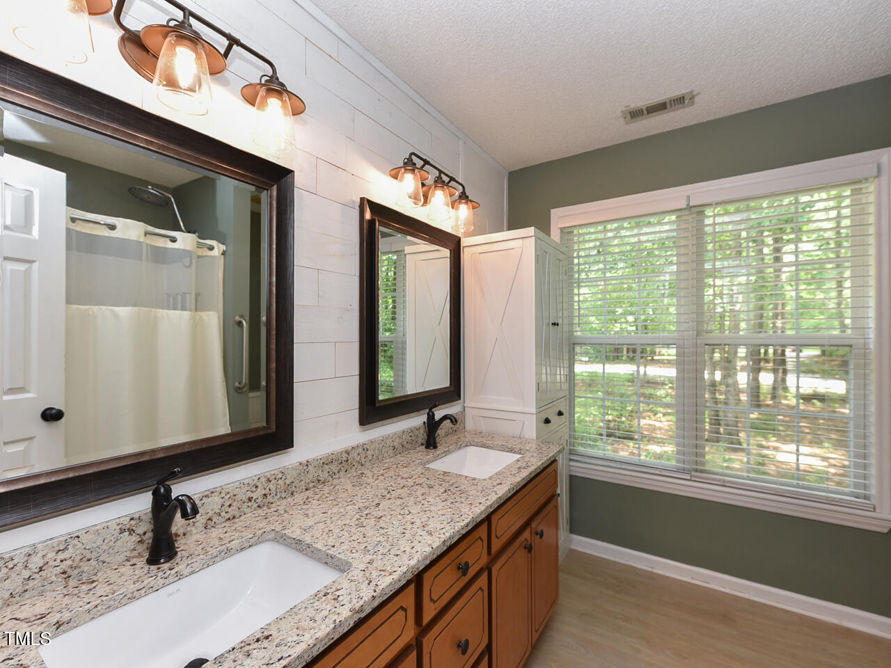 125 Walker Run Selma, NC 27576 - Photo 23 of 47 a bathroom with a granite countertop sink and a mirror