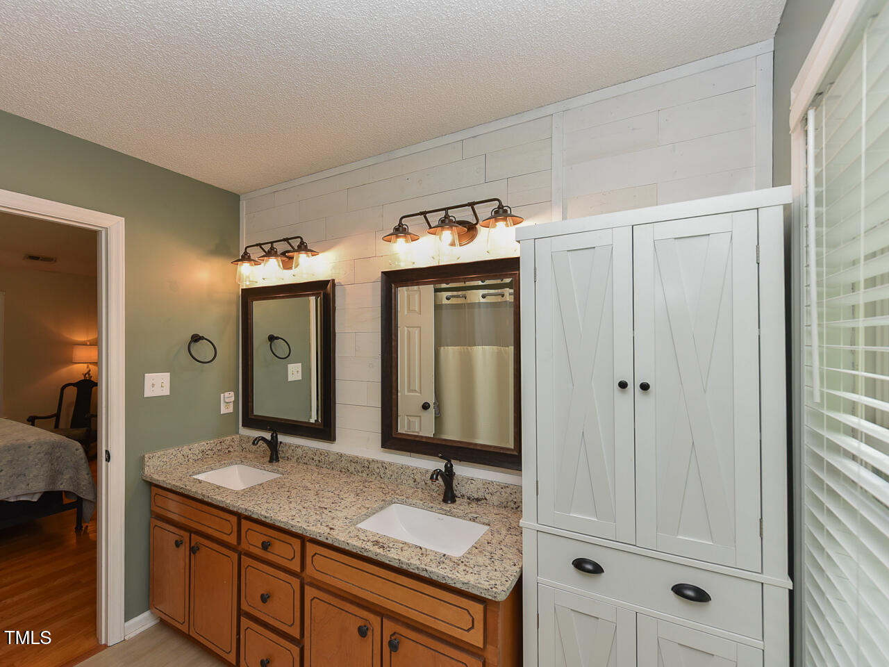 125 Walker Run Selma, NC 27576 - Photo 24 of 47 a bathroom with a granite countertop sink vanity and mirror
