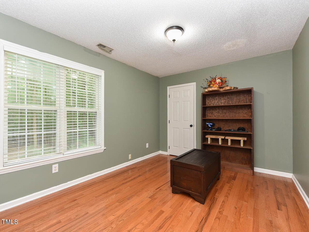 125 Walker Run Selma, NC 27576 - Photo 27 of 47 a living room with furniture and a wooden floor