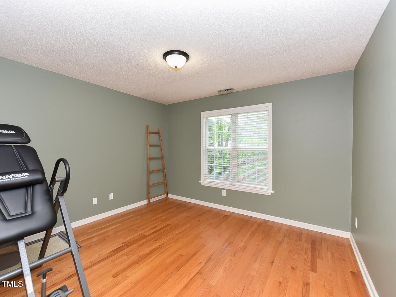 125 Walker Run Selma, NC 27576 - Photo 28 of 47 a view of a livingroom with wooden floor and a window