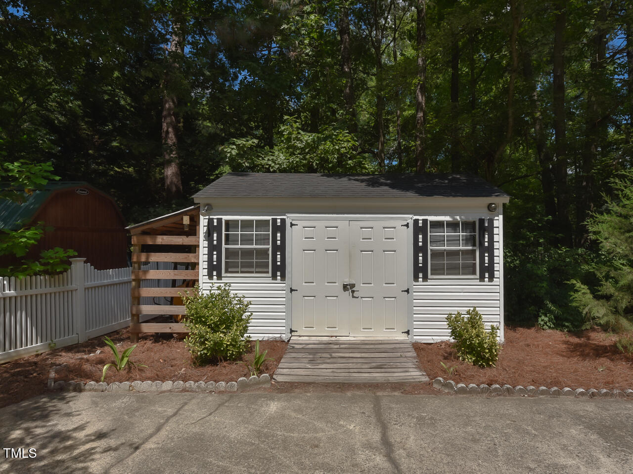 125 Walker Run Selma, NC 27576 - Photo 36 of 47 front view of a house with a bench