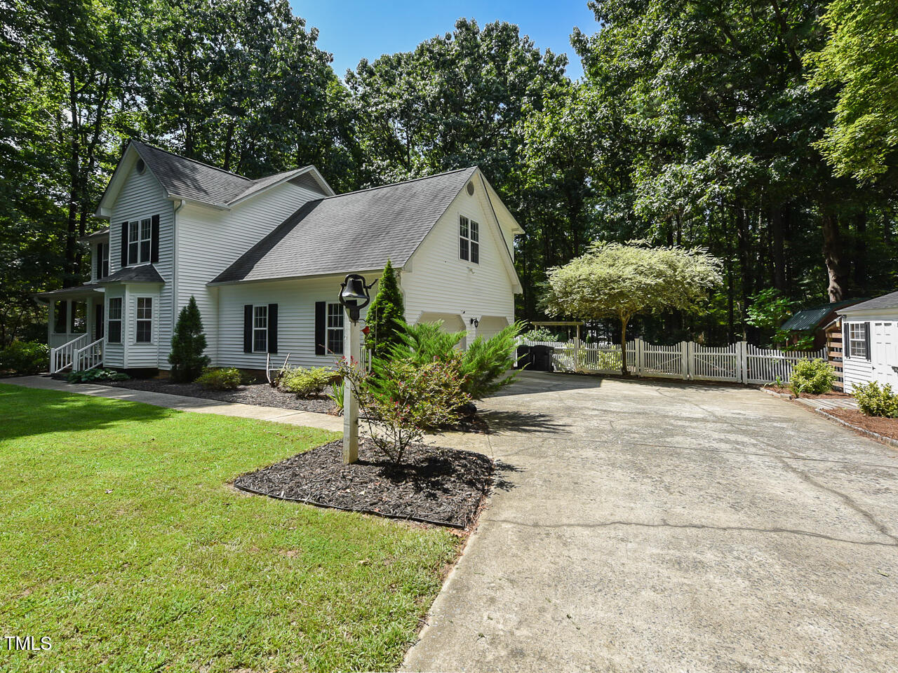 125 Walker Run Selma, NC 27576 - Photo 5 of 47 a front view of a house with a yard and porch