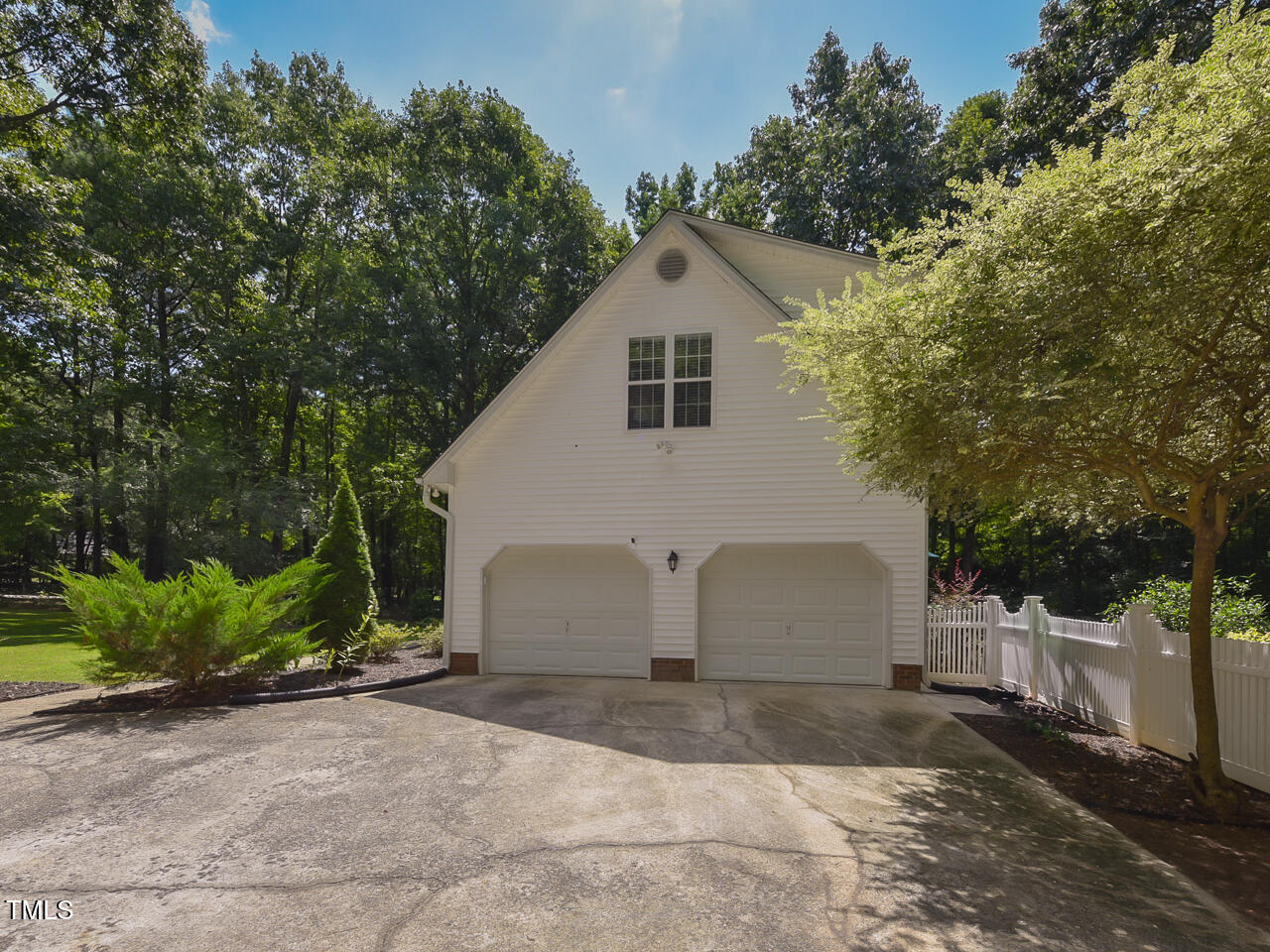 125 Walker Run Selma, NC 27576 - Photo 6 of 47 a view of a white house with a yard and large tree