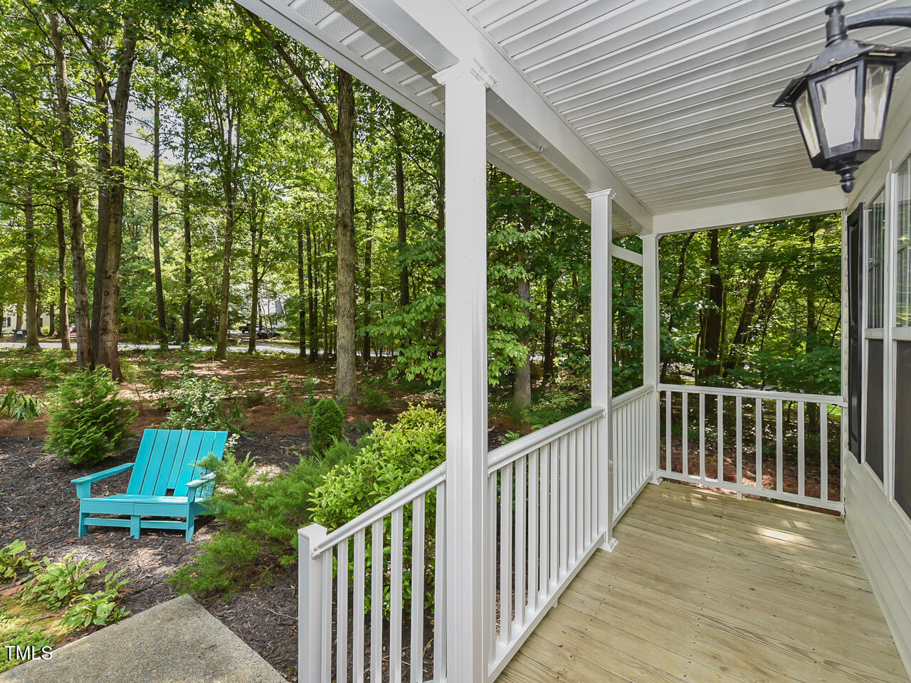 125 Walker Run Selma, NC 27576 - Photo 9 of 47 a view of a patio with table and chairs and wooden floor