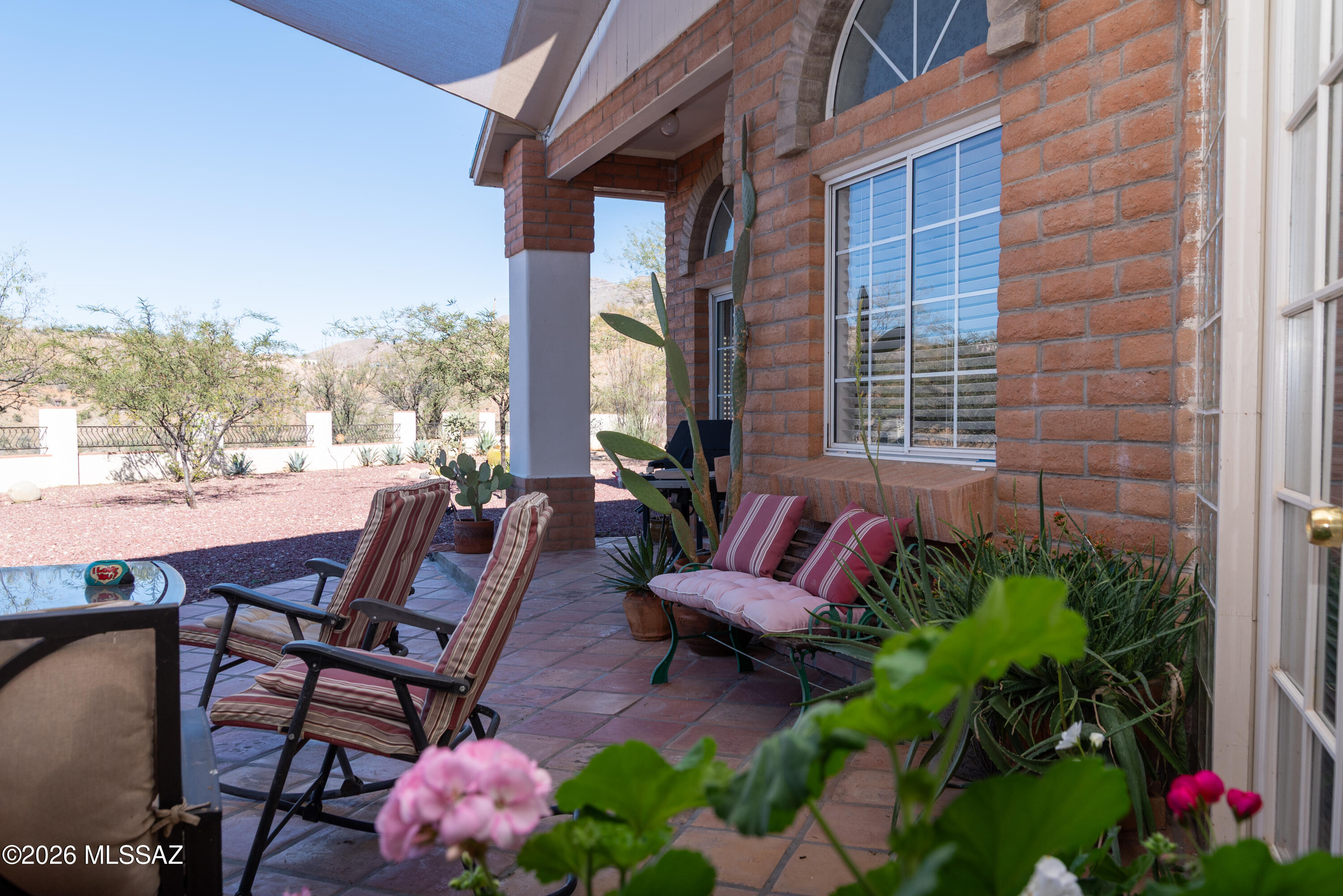 1242 Vista Court Rio Rico, AZ 85648 - Photo 15 of 16 a view of a patio with table and chairs and potted plants