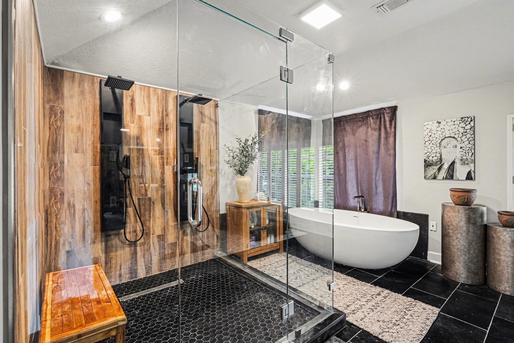 17519 Hawkin Lane Tomball, TX 77377 - Photo 30 of 48 Spa-like primary bathroom featuring a freestanding soaking tub, oversized glass shower with dual shower heads, and modern finishes throughout.