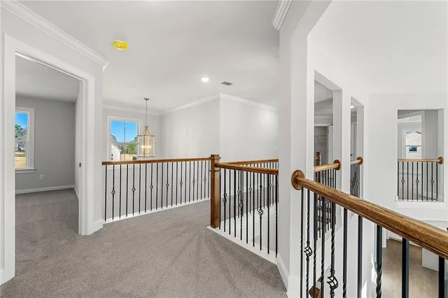 a view of a hallway with windows