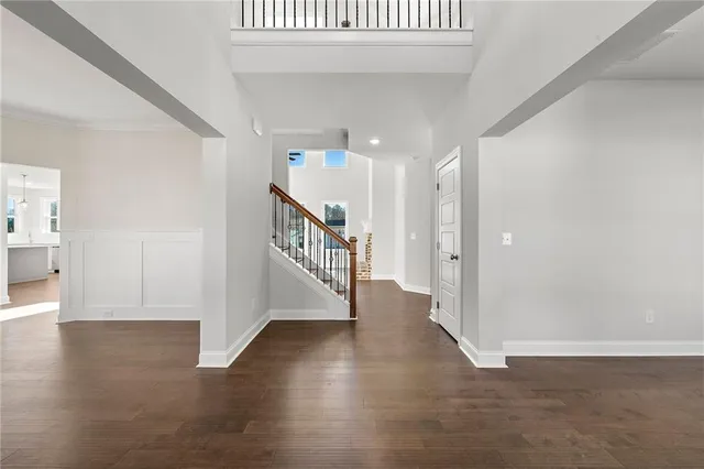 a view of an entryway with wooden floor