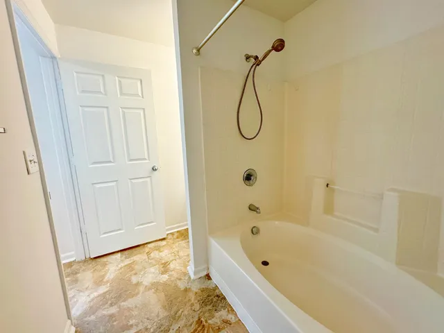 a bathroom with a bath tub