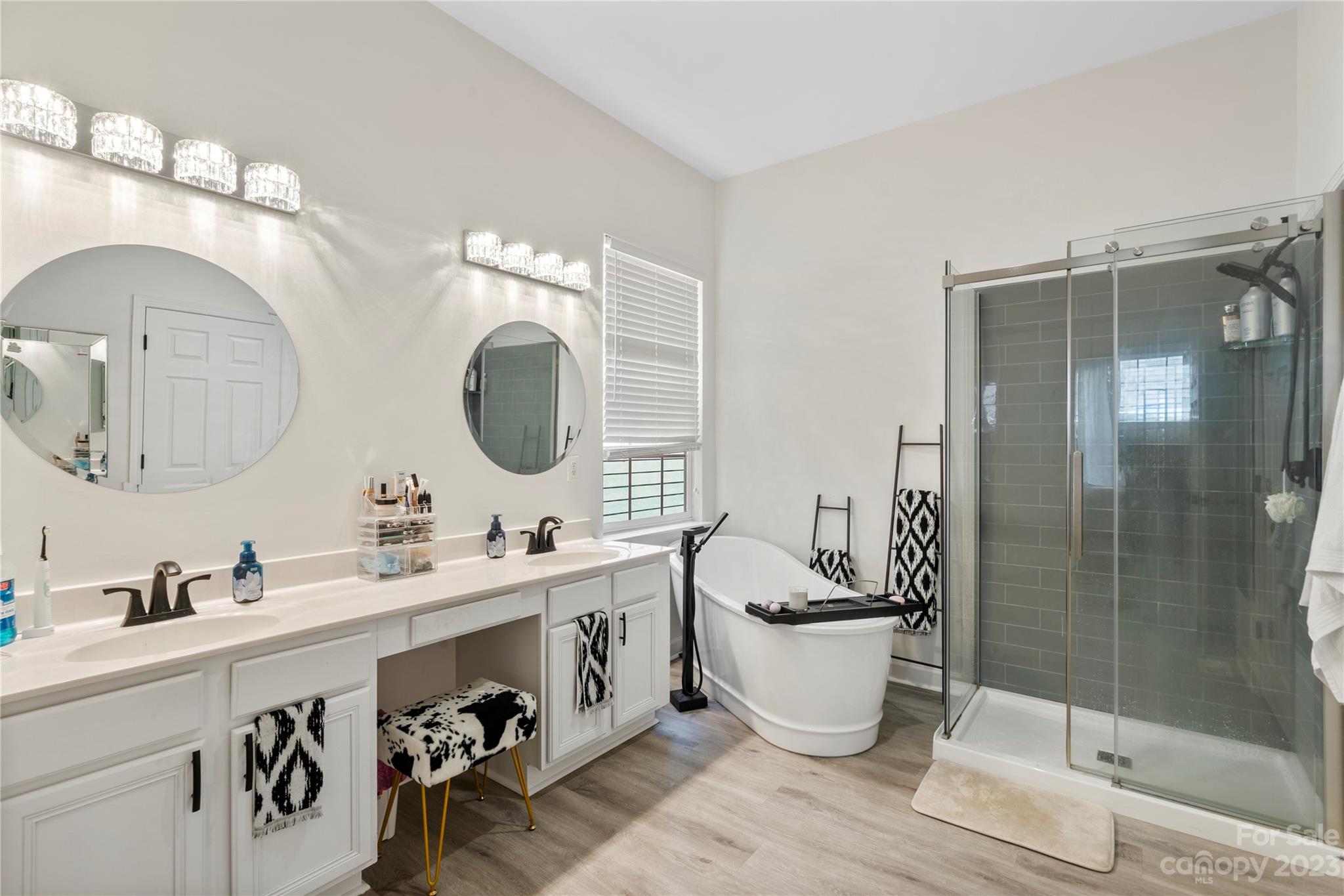 8315 Camberly Road Huntersville, NC 28078 - Photo 16 of 31 a bathroom with a double vanity sink mirror and bathtub