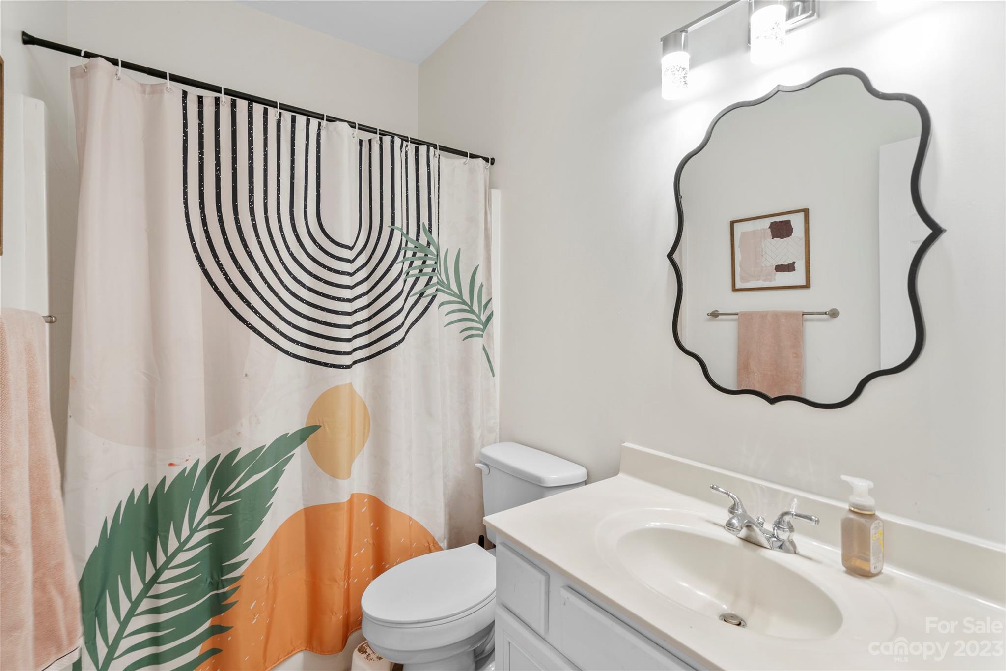 8315 Camberly Road Huntersville, NC 28078 - Photo 20 of 31 a bathroom with a sink mirror and toilet