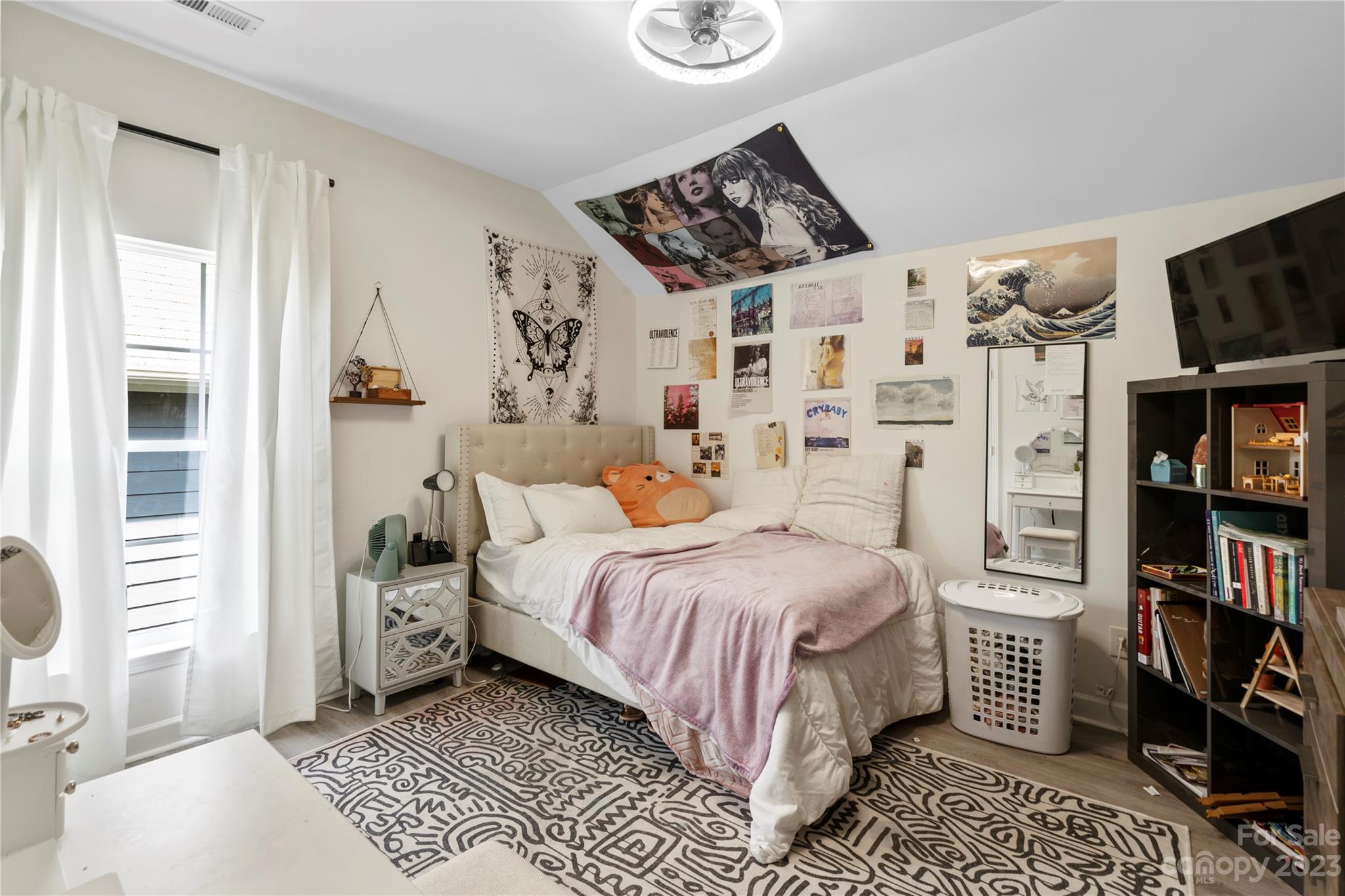 8315 Camberly Road Huntersville, NC 28078 - Photo 23 of 31 a bedroom with a bed and walk in closet with clothes