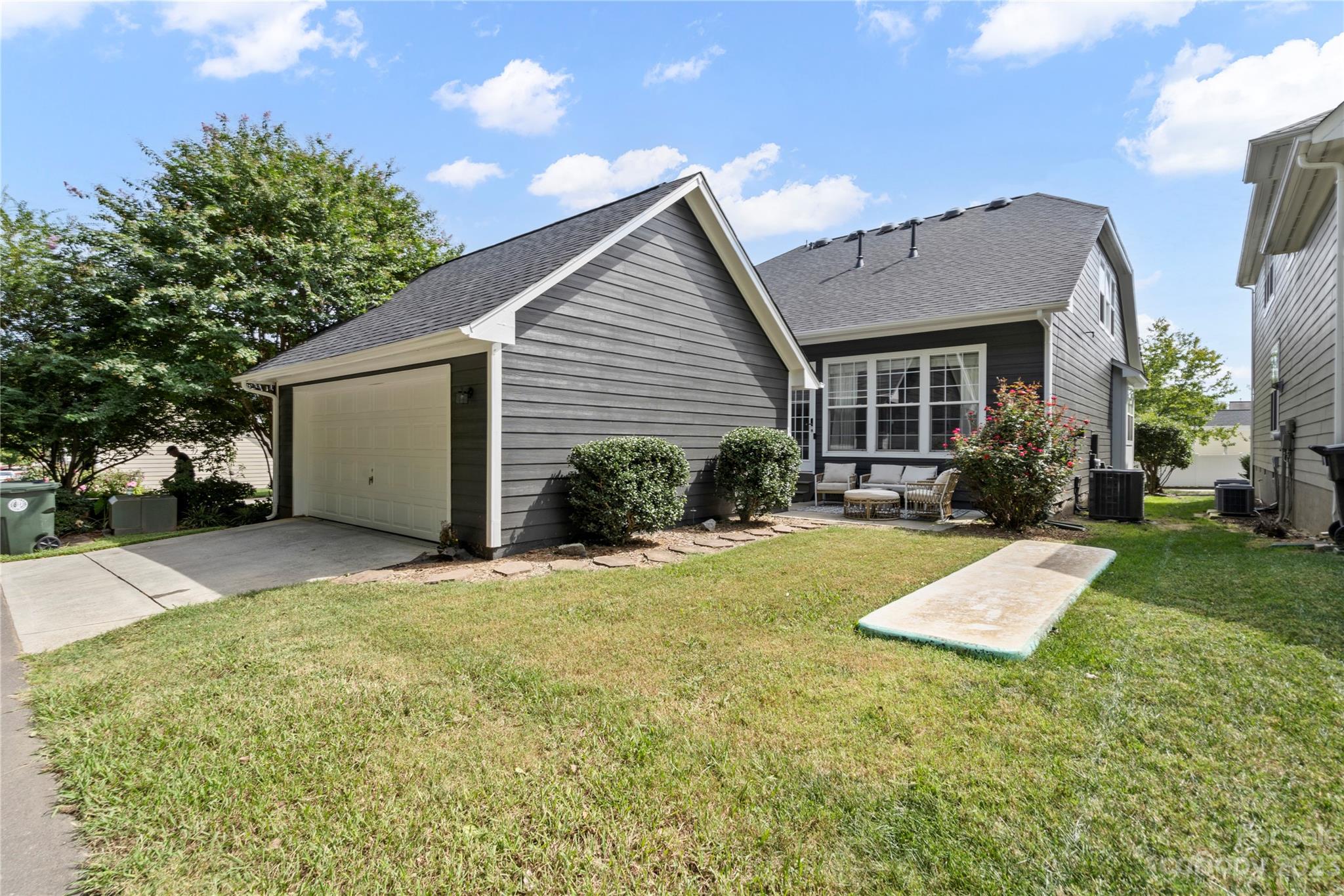 8315 Camberly Road Huntersville, NC 28078 - Photo 26 of 31 a view of a house with backyard and plants