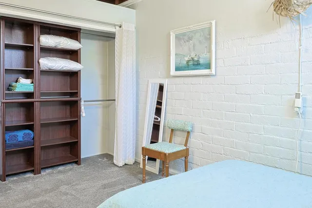 a room with a chair and a window