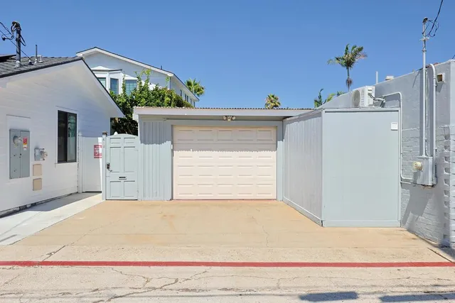 a front view of a house with a garage