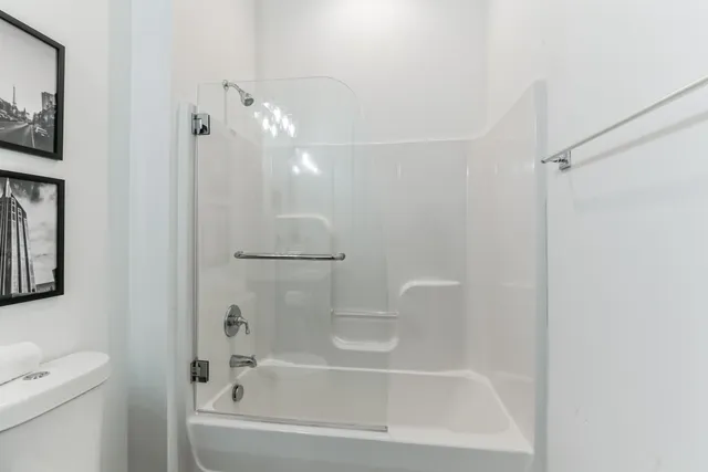 a bathroom with a bathtub and a shower