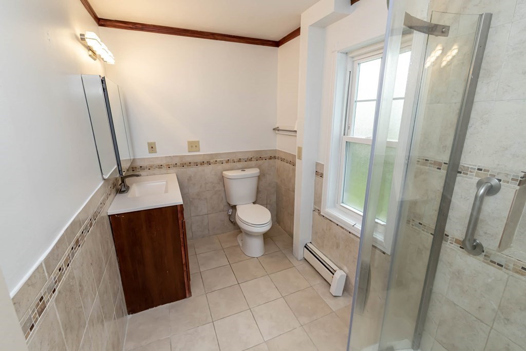 1 May Court Methuen, MA 01844 - Photo 17 of 40 a bathroom with a granite countertop sink toilet and shower