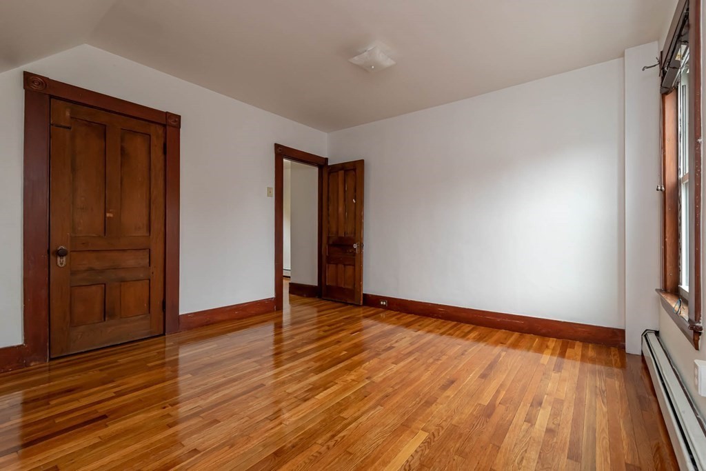 1 May Court Methuen, MA 01844 - Photo 19 of 40 a view of an empty room with wooden floor and a window