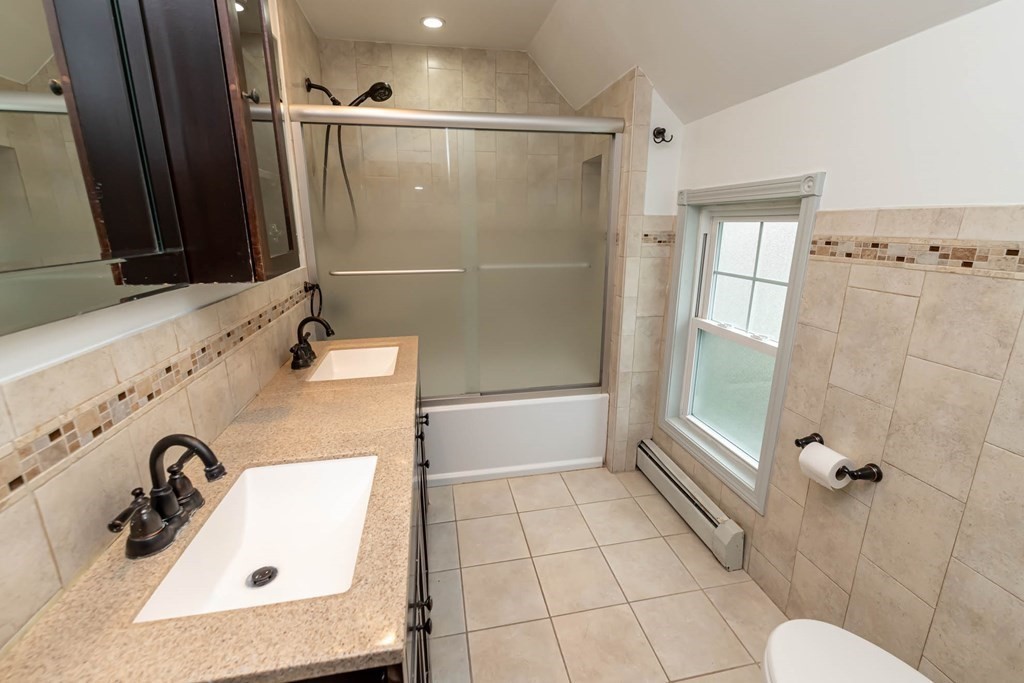 1 May Court Methuen, MA 01844 - Photo 20 of 40 a bathroom with a sink mirror toilet and shower