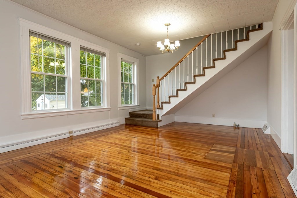 1 May Court Methuen, MA 01844 - Photo 24 of 40 a view of entryway and hall with wooden floor