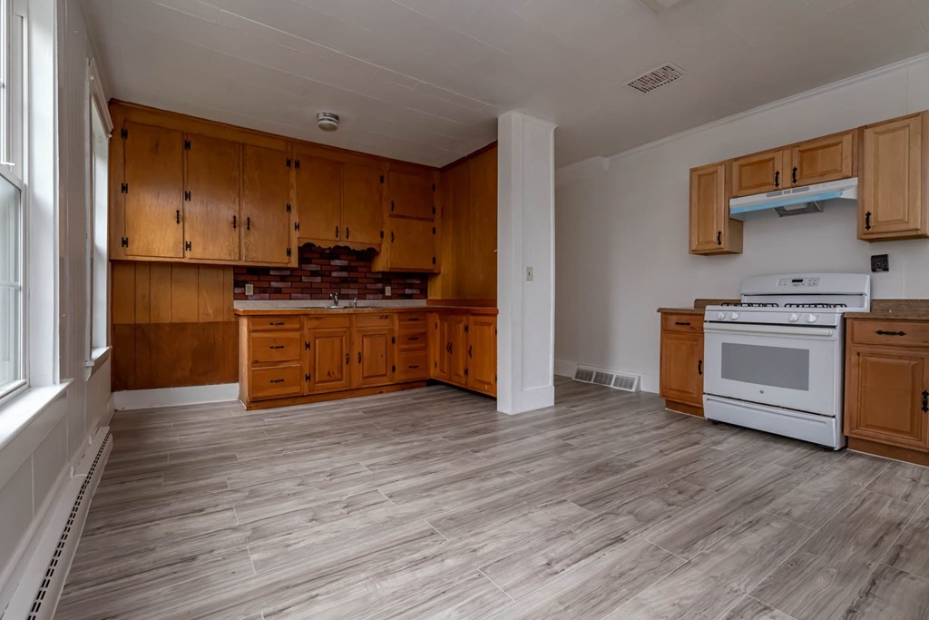 1 May Court Methuen, MA 01844 - Photo 28 of 40 a kitchen with stainless steel appliances a stove top oven and sink
