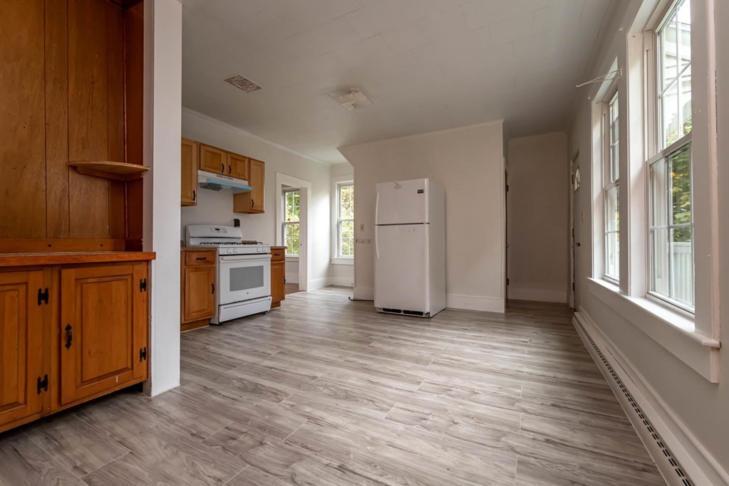 1 May Court Methuen, MA 01844 - Photo 29 of 40 an empty room with wooden floor closet and windows
