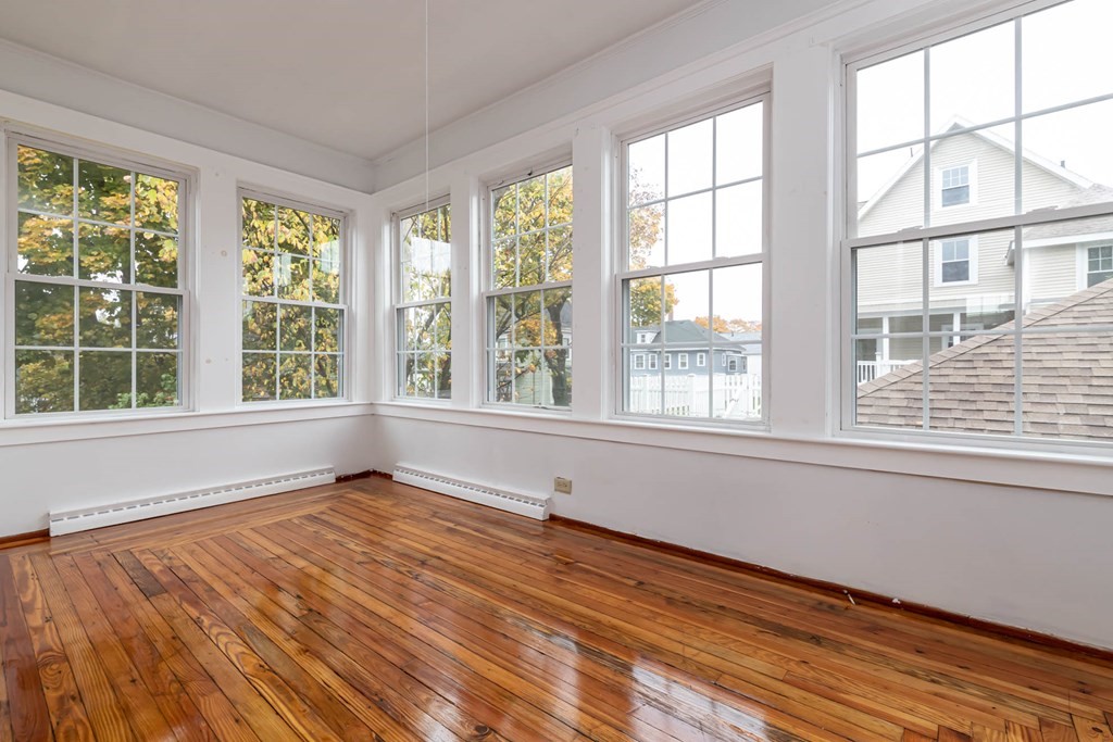 1 May Court Methuen, MA 01844 - Photo 30 of 40 a view of an empty room with wooden floor and a window